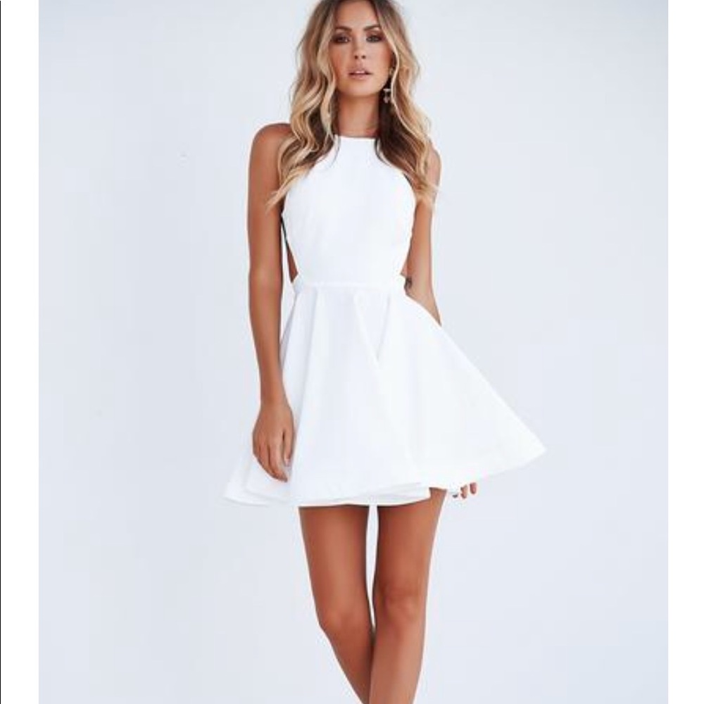 Xenia fortune backless mini dress. NWT, Size small